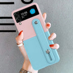 Pink/Light Blue Color Block Folding Bracelet Stand Extendable Spray Painted Dual-Tone Stitching Frosted Texture Lens Protection Stylish Foldable Phone Case Anti-Fall Phone Cover Compatible With Samsung Galaxy Z Flip 4 Mobile Case by CoverMeUp - Style 7