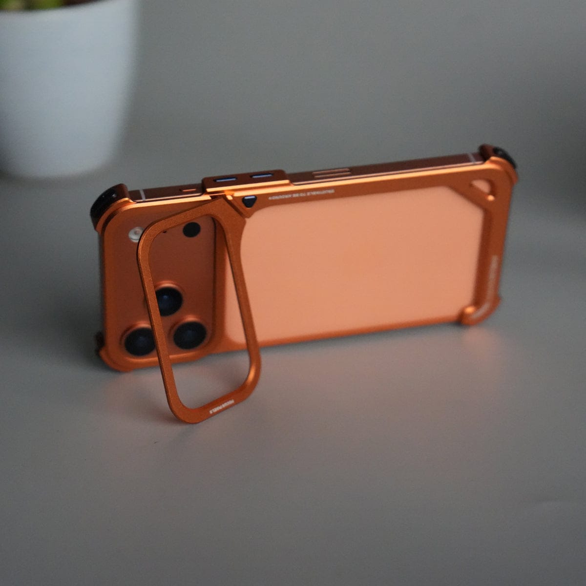 iPhone 17 Pro max 9-Shaped Frameless Metal Bumper Case with Hidden Lens Stand | Shockproof Aviation-Grade Alloy Frame