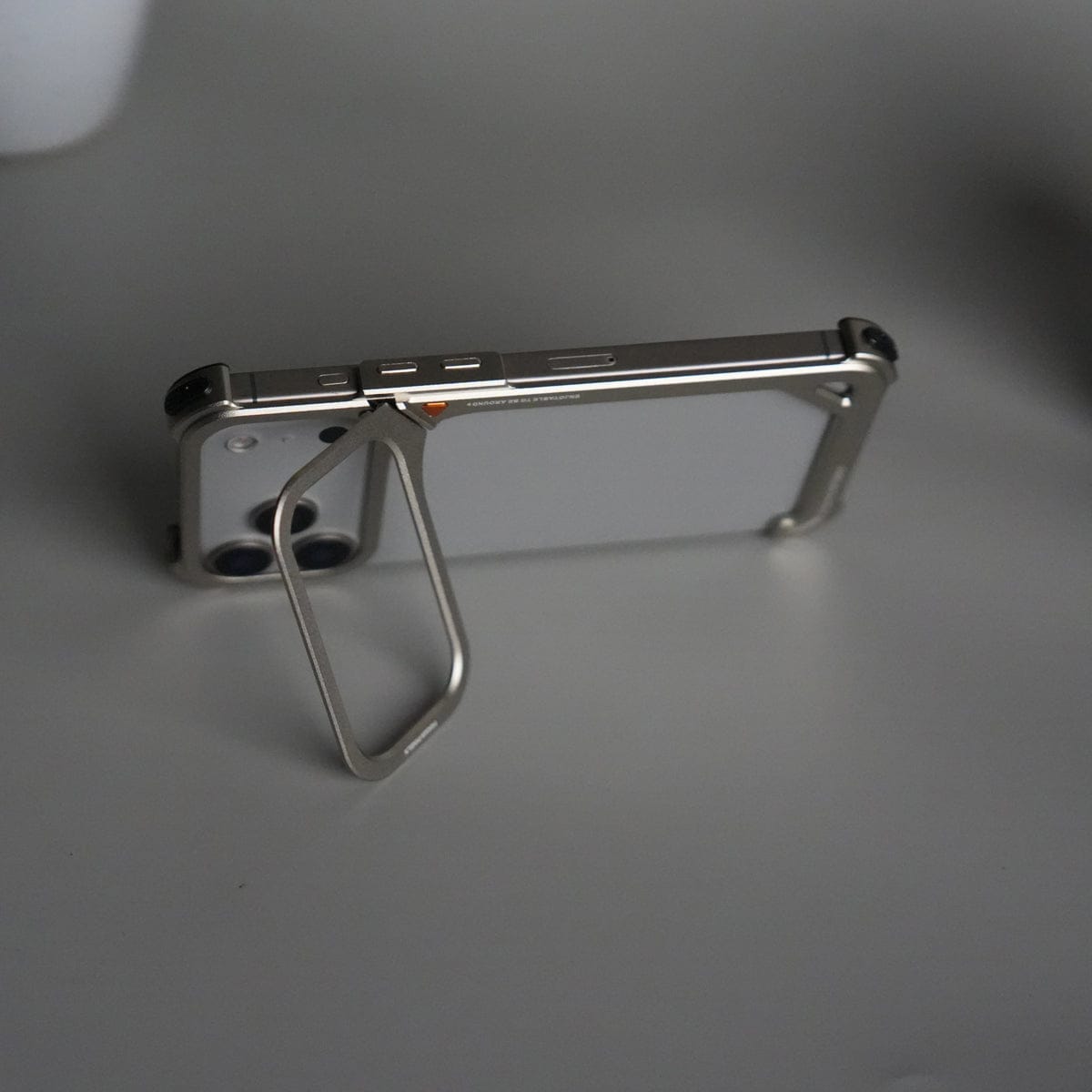 iPhone 17 Pro max 9-Shaped Frameless Metal Bumper Case with Hidden Lens Stand | Shockproof Aviation-Grade Alloy Frame