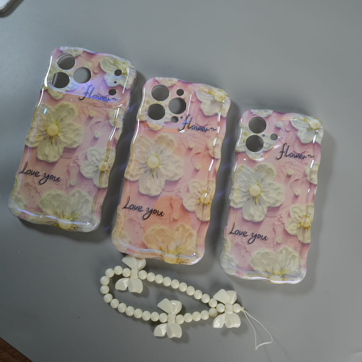 iPhone Series Cute Floral Wavy Glossy Case with Beaded Bow Charm