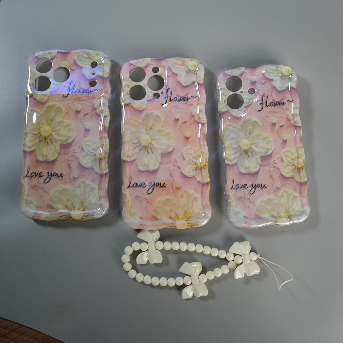 iPhone Series Cute Floral Wavy Glossy Case with Beaded Bow Charm